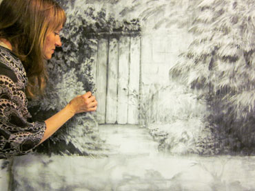 Thumbnail image of Jo Sheppard working on a charcoal drawing by Jo Sheppard