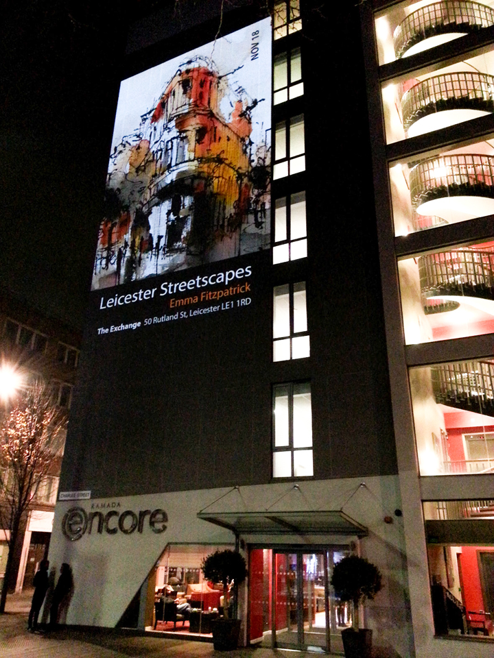 Emma Fitzpatrick poster projected on a building in Leicester's Cultural Quarter