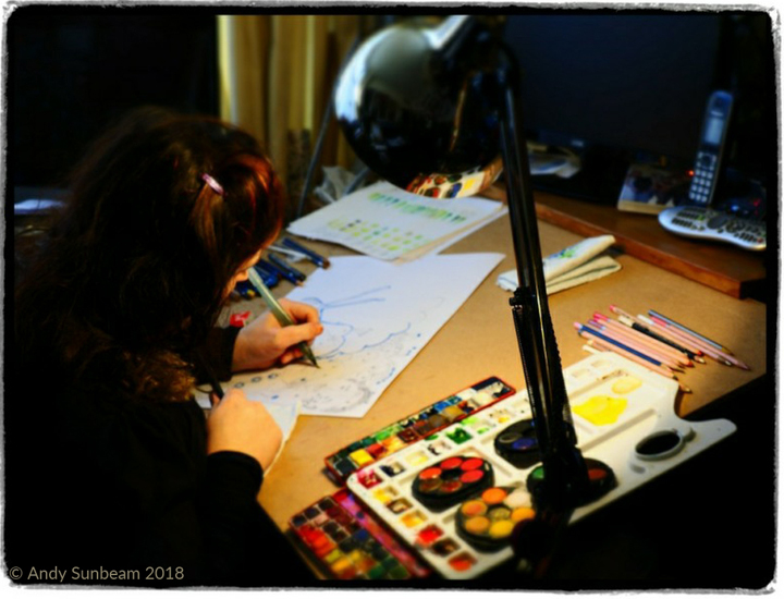 Jane Sunbeam working on drawings