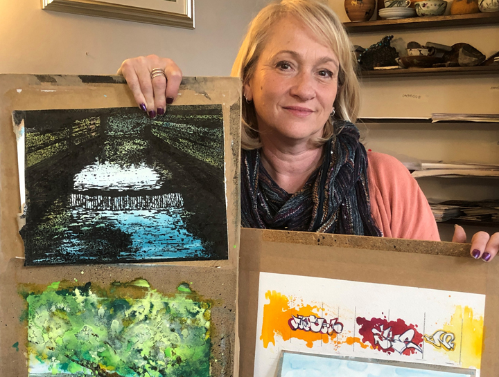 artist Jo Sheppard with examples of gouache washoff paintings