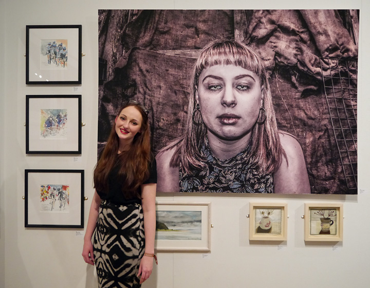Tiffany Tangen in front of her prize winning photograph