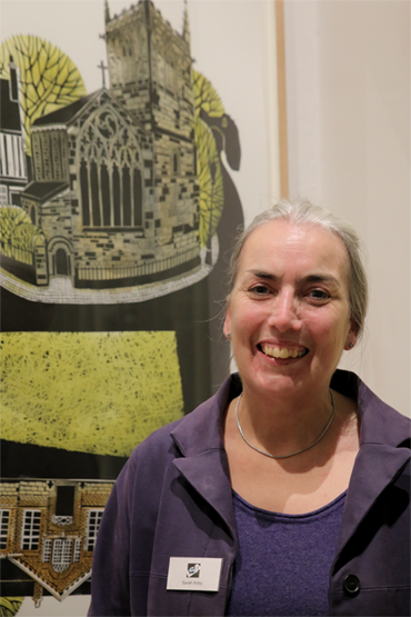 Thumbnail image of Sarah Kirby in front of 'St Mary de Castro and Castle Yard', linocut - LSA Annual Exhibition 2017 Prize Winners
