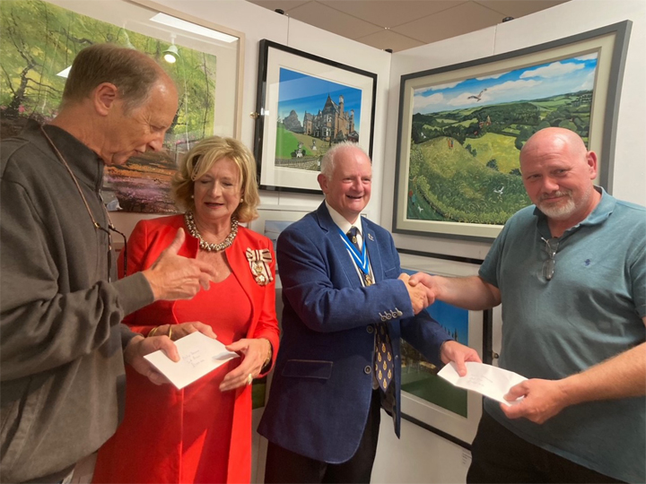Philip Dawson and Kevin Holdaway receive their prizes at the Rutland Open Art Exhibition