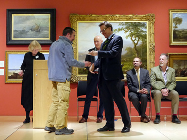 Thumbnail image of Chris Hailes of sponsors Charles Stanley presenting the prize to Charles Stanley Bronze Prize winner Dylan Waldron - Preview Evening: LSA Annual Exhibition 2016