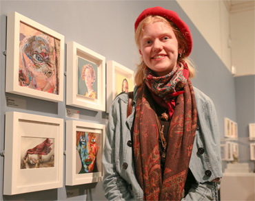Thumbnail image of Becky Hayley (Oakham School student) in front of her prizewinning work 'The Red Scarf' - Little Selves - Preview Photographs