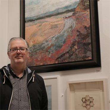 Thumbnail image of LSA member Alan Hopwood in front of his picture 'Low Tide Across St Austell Bay', which won the LSA Chair's Prize - LSA Annual Exhibition 2017 Preview Evening